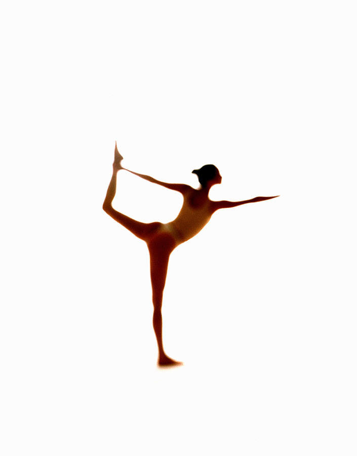 Ballet Dancer Photograph - Silhouette Of Woman Balancing On One Leg by John Slater