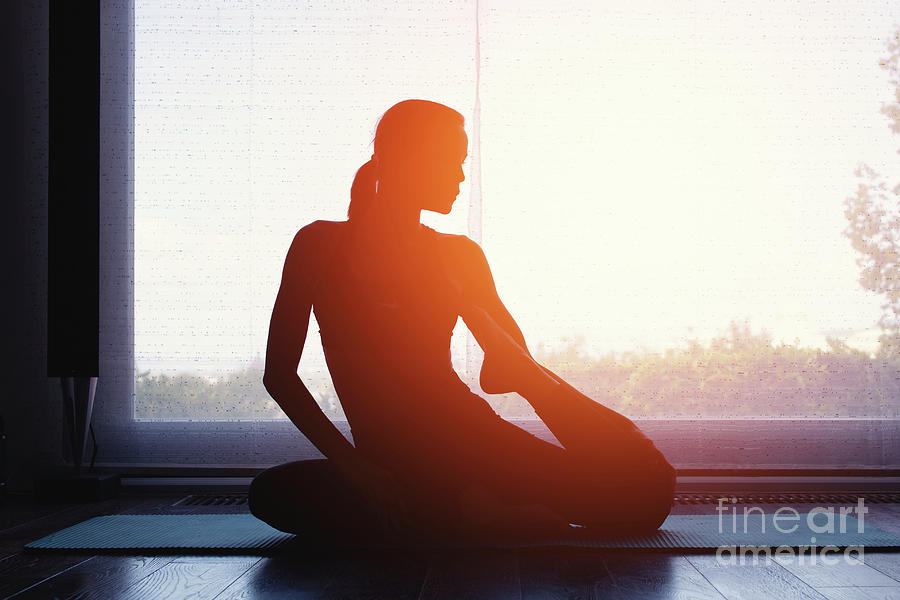Silhouette Of Woman Doing Yoga At Home At Sunrise Photograph by Sakkmesterke/science Photo Library