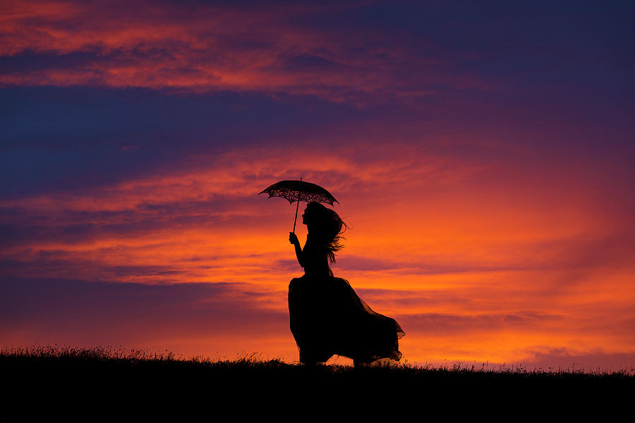Silhouette of young woman running at sunset Photograph by Maggie Mccall
