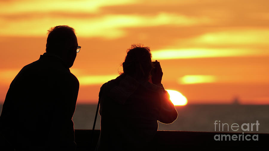 Silhouetted Old Couple Photographing the Sunset Photograph by Pablo Avanzini