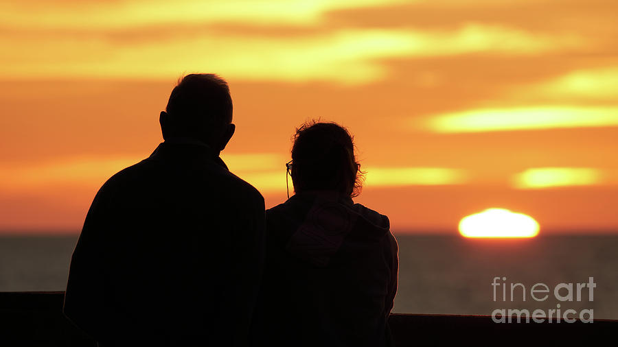 Silhouetted Old Couple Staring at the Sunset Photograph by Pablo Avanzini