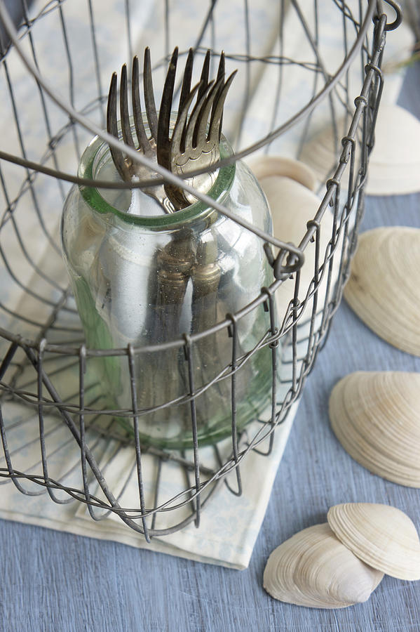 Silver Forks In Glass In Wire Basket Photograph by Martina Schindler
