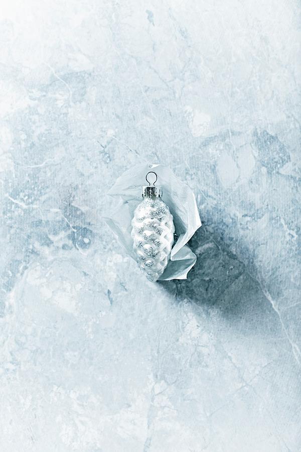 Silver Pine-cone Decoration On Grey Marble Surface Photograph by B.&.e.dudzinski