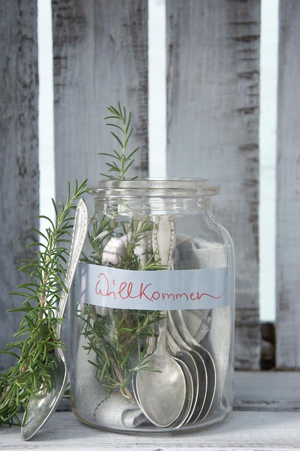 Silver Spoons And Rosemary In Mason Jar With Welcome Sign Photograph by Martina Schindler