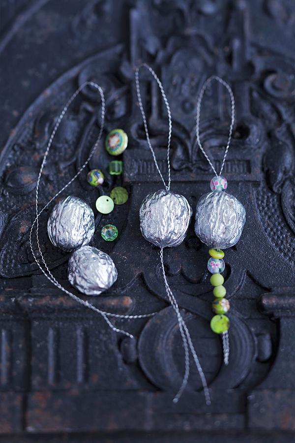 Silver Walnuts With Decorative Beads As Tree Decorations Photograph by Anke Schtz