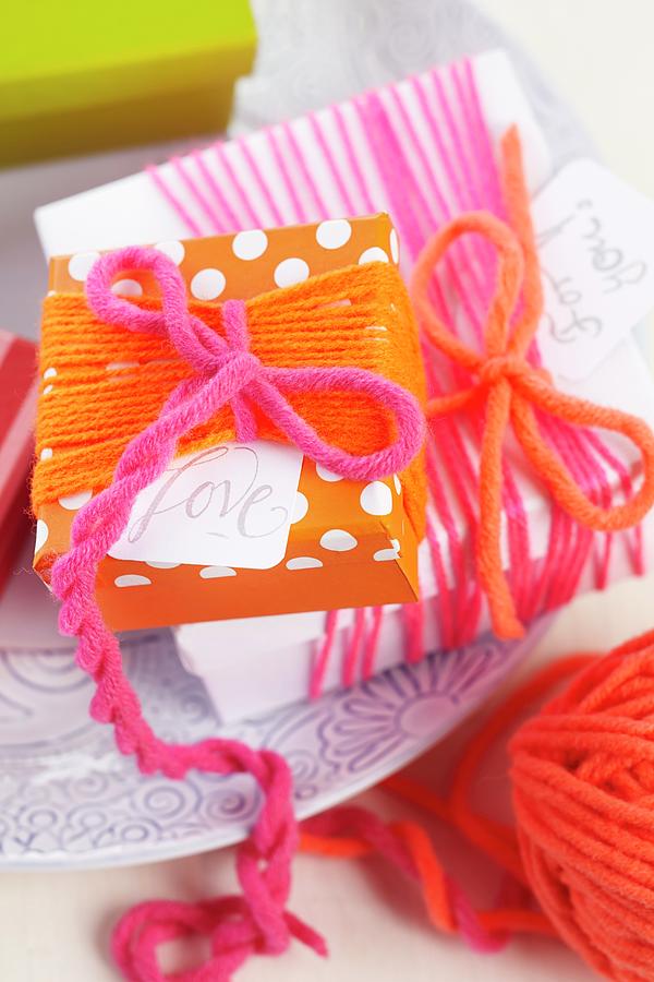 Simple Gift Box Wrapped In Colourful Woollen Yarn Photograph by Franziska Taube