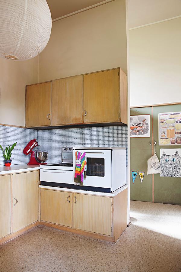 Simple Retro Kitchen Area With Electronic Appliances On Base Units And Pale Wooden Wall Units Photograph by Natalie Jeffcott