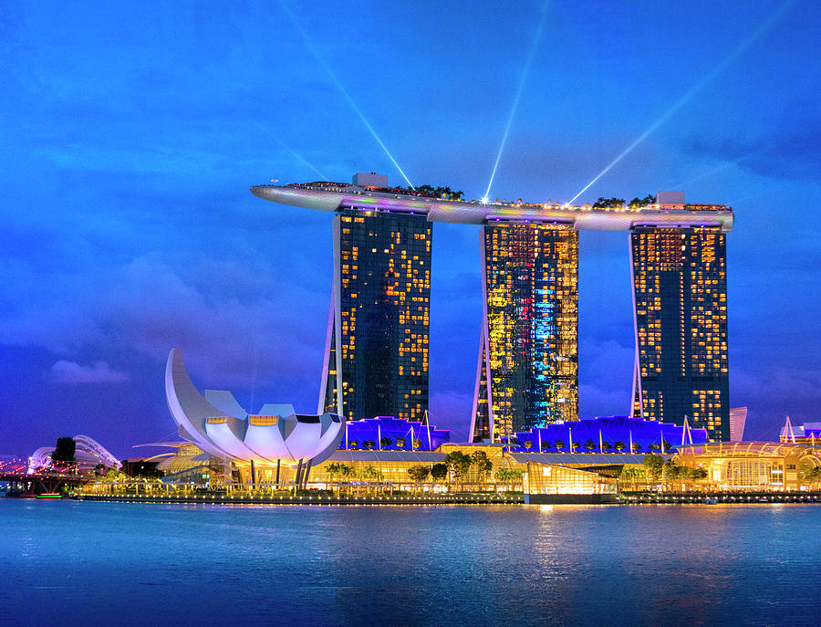 Singapore, Singapore City, Marina Bay, Seafront Promenade In The Evening And Night Lights. City Center And Financial Center. Marina Bay Sands Hotel Digital Art by Paolo Giocoso