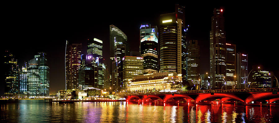 Singapore Skyline By Night Photograph by Marc Rauw