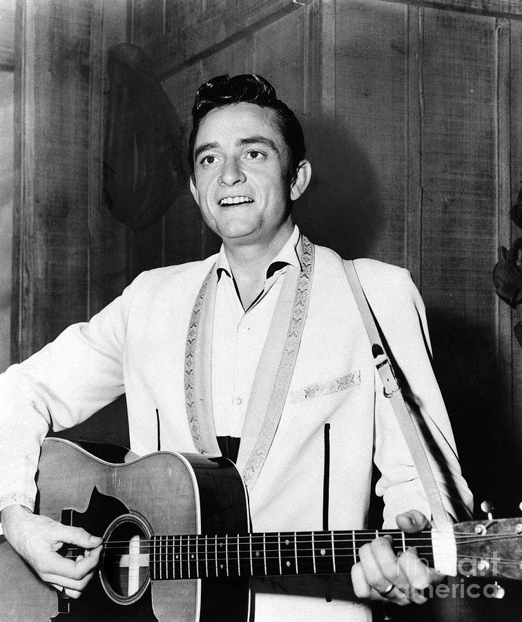 Singer Johnny Cash Playing Guitar Photograph by Bettmann