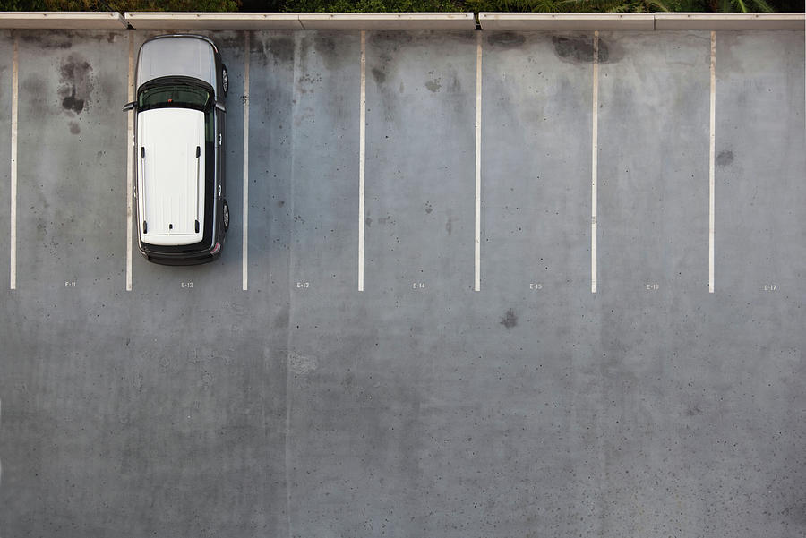 Single Car On A Parking Lot Photograph by Slobo