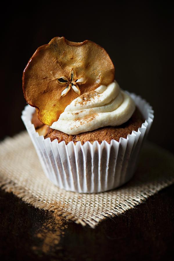 Single Cupcake With Apple Crisp And Sprinkle Of Cinnamon Photograph by Magdalena Hendey