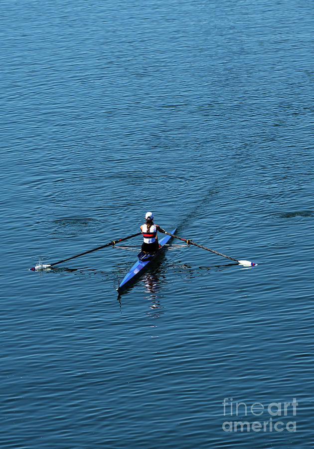 Single Female Rower In Racing Boat  Photograph by Andreas Berthold