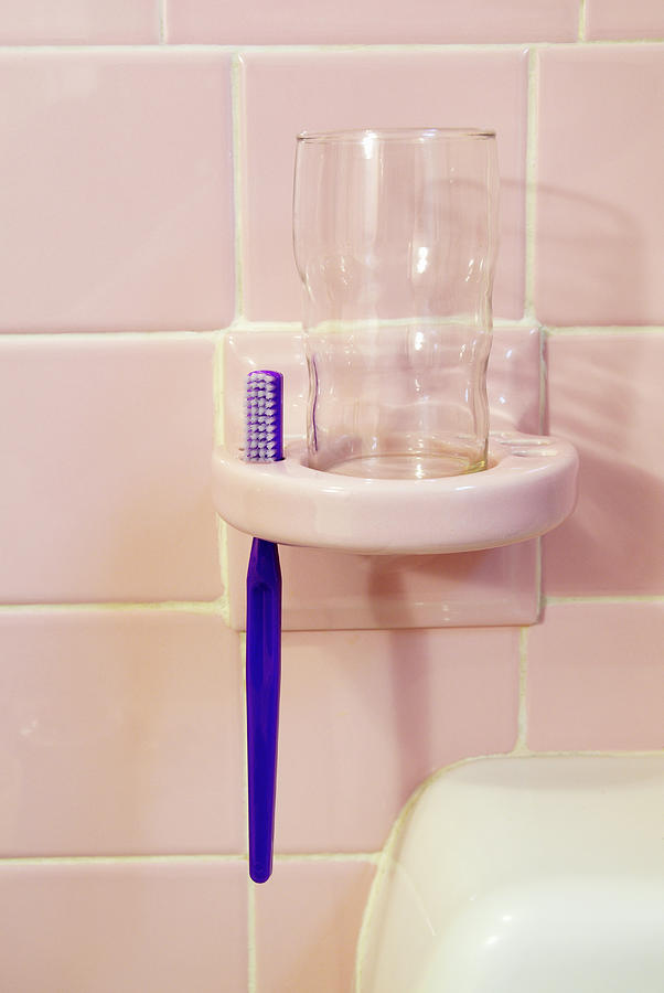 Toothbrush Photograph - Single Toothbrush In A Holder In A by David Mcglynn