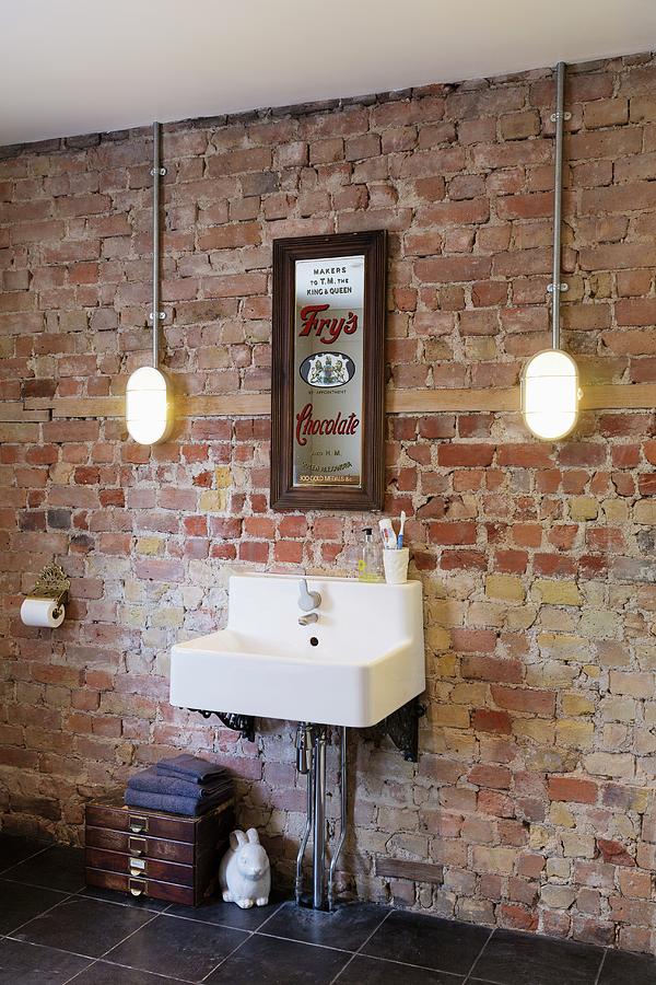 Sink Mounted On Unrendered Brick Wall Photograph by Rikard Osterlund