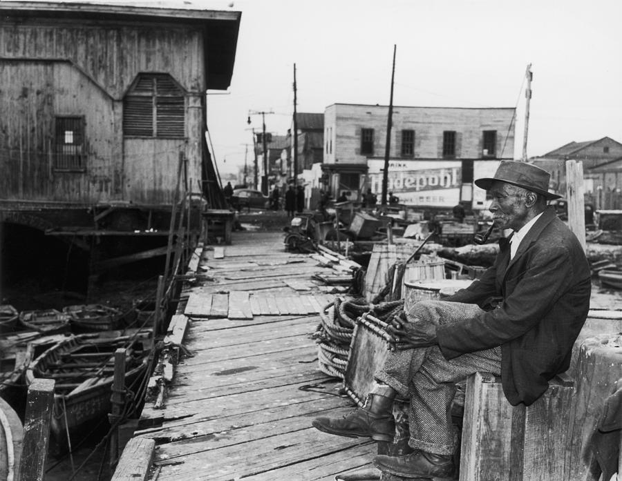 Sitting At The Dock Photograph by American Stock Archive