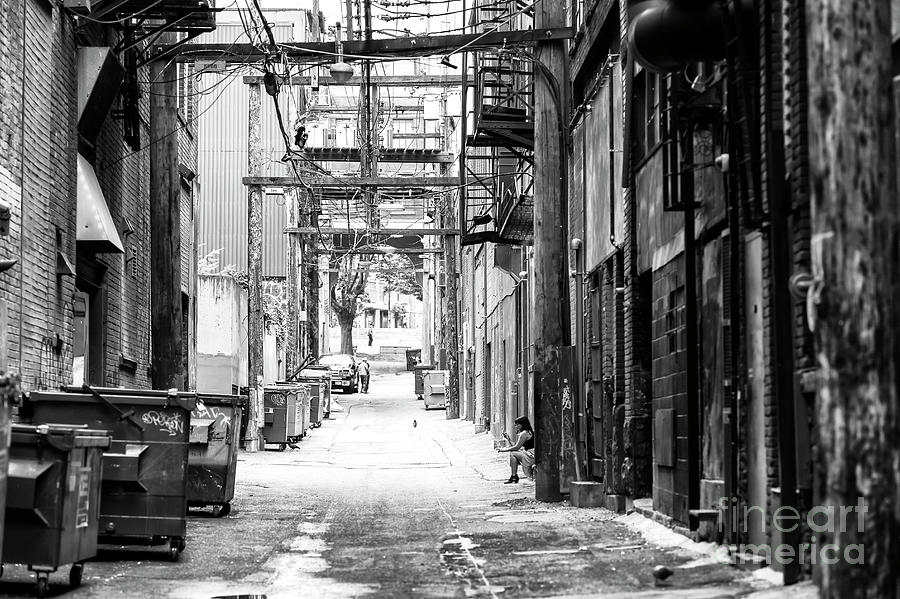 Sitting in the Gastown Alley in Vancouver Photograph by John Rizzuto