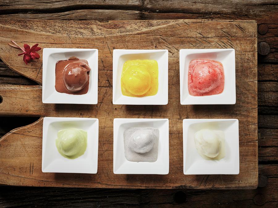 Six Different Flavours Of Ice Cream: Chocolate, Pineapple, Strawberry, Pistachio, Coconut And Vanilla Photograph by Martin Dyrlv