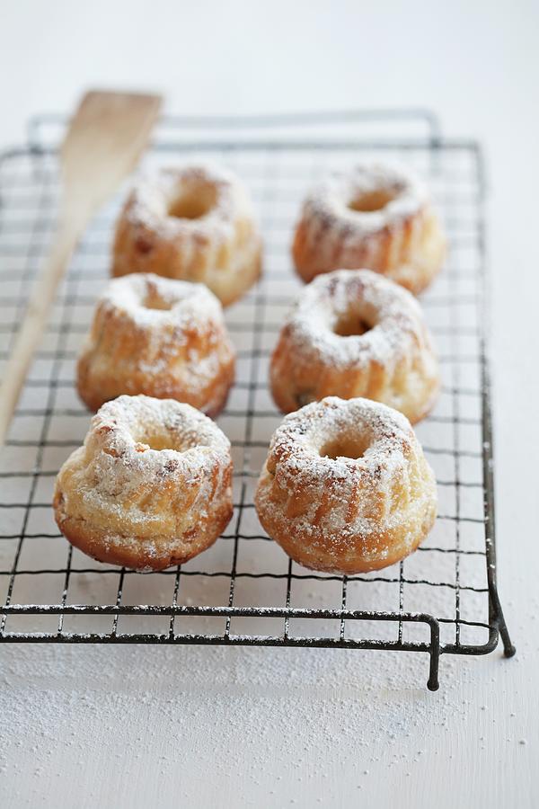 Six Mini Bundt Cakes With Pieces Of Pear On A Cooling Rack Photograph by Schindler, Martina