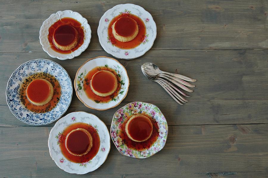 Six Servings Of Creme Caramel Photograph by Debra Cowie