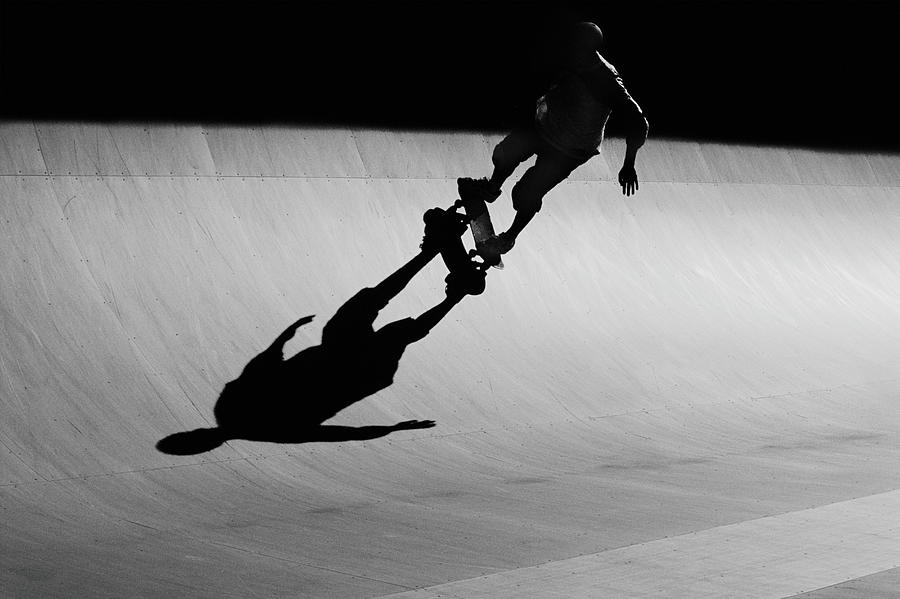 Skateboarder Riding Ramp At Skate Park Photograph by David Madison