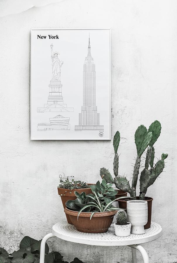 Sketches Of New York On Wall Above Plants On Table Photograph by Agata Dimmich
