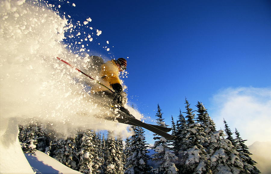 Skier In Midair, Creating Snow Spray by Mike Powell