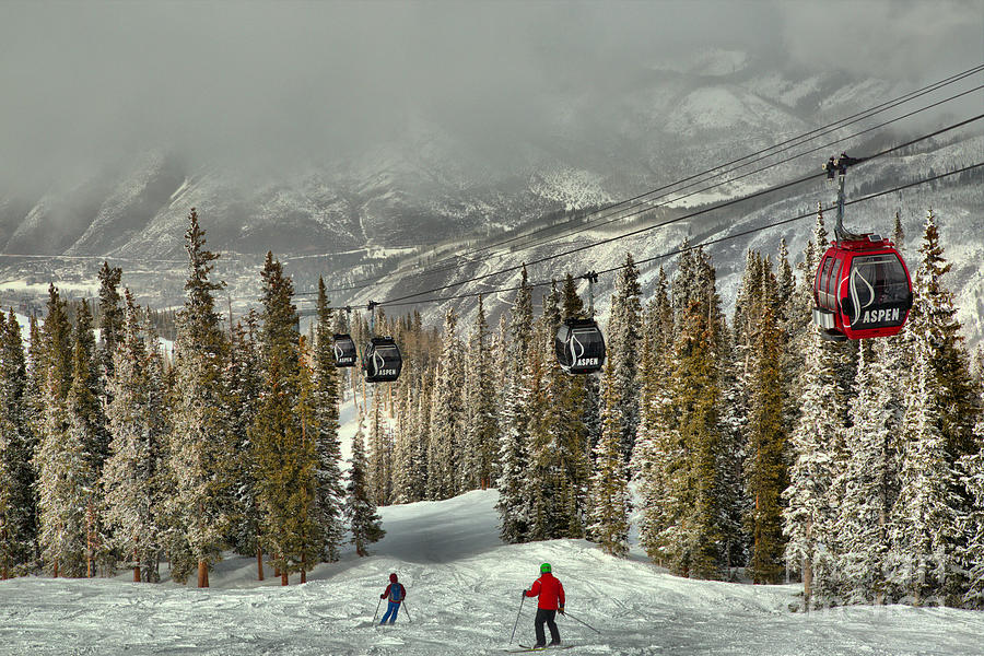 Skiers Under The Aspen Gondola Photograph by Adam Jewell