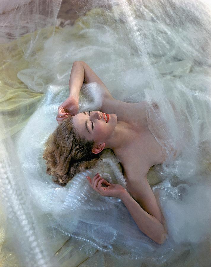 Sleeping Model In White Lace Bedding Photograph by Toni Frissell