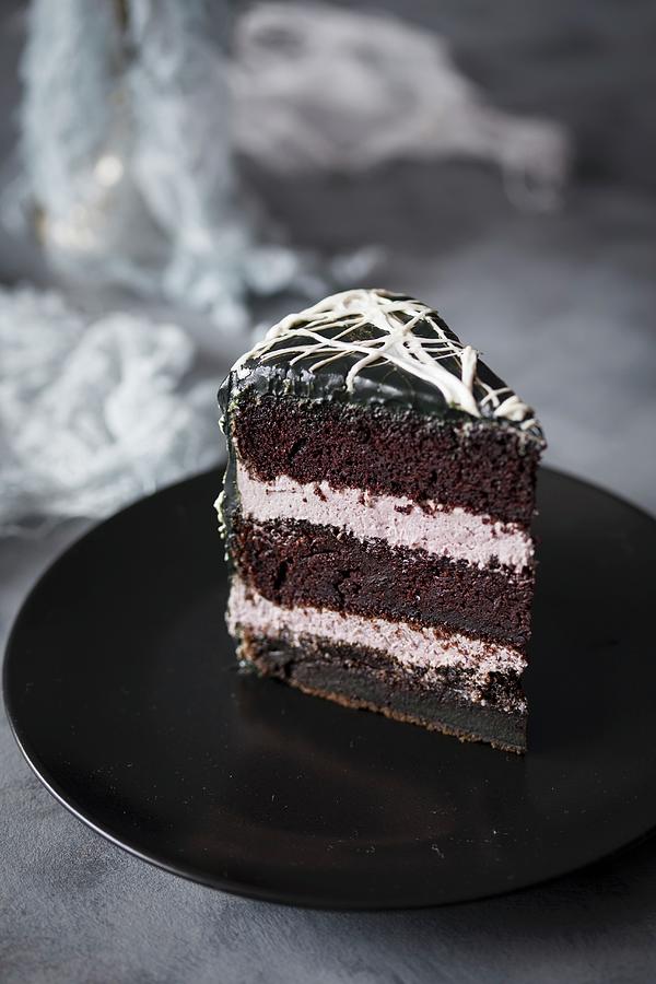 Slice Of A Halloween Cake With Black Frosting And Marshmallow Spider's ...