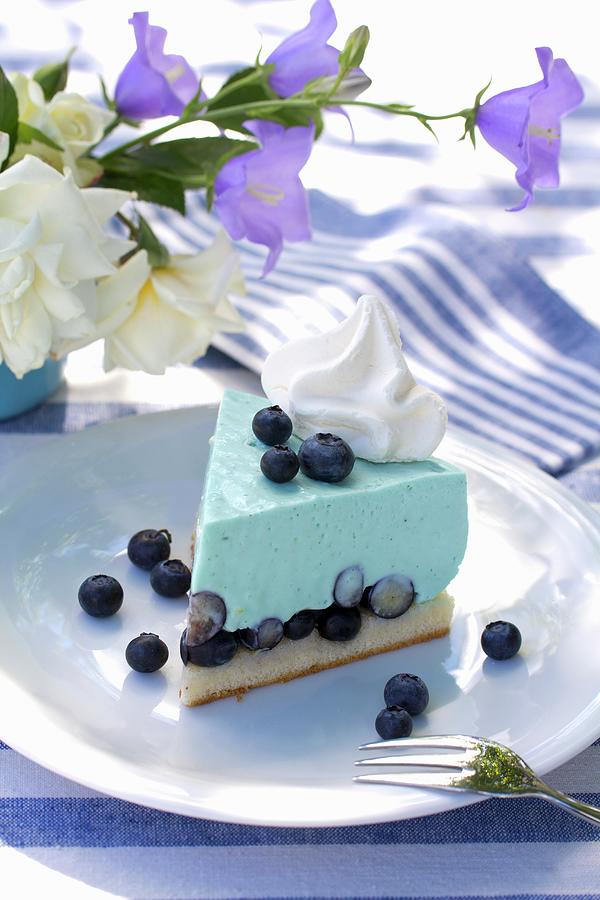 Slice Of Blueberry Mousse Tart On Table Set In Blue And White Photograph by Angela Francisca Endress