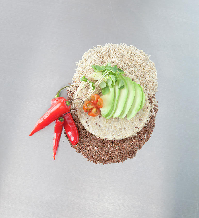 Sliced Avocado And Peppers With Grains Photograph by Laurie Castelli