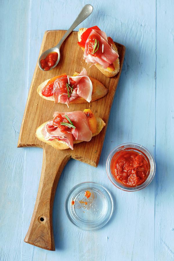 Sliced Baguette Topped With Serrano Ham, Grilled Peppers And Hot Tomato Salsa Photograph by Rua Castilho