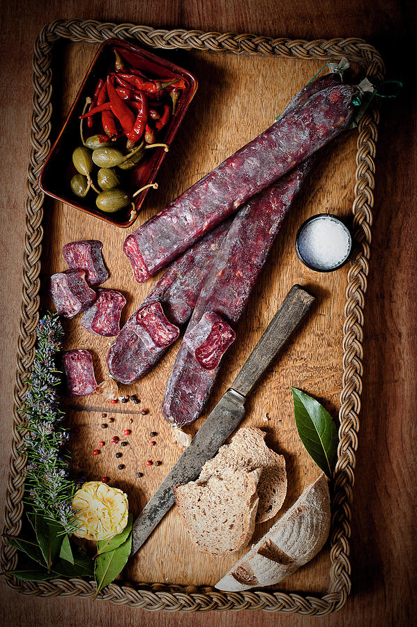 Sliced Beef Salami On A Wooden Tray With Bread And Salt Photograph by Tomasz Jakusz