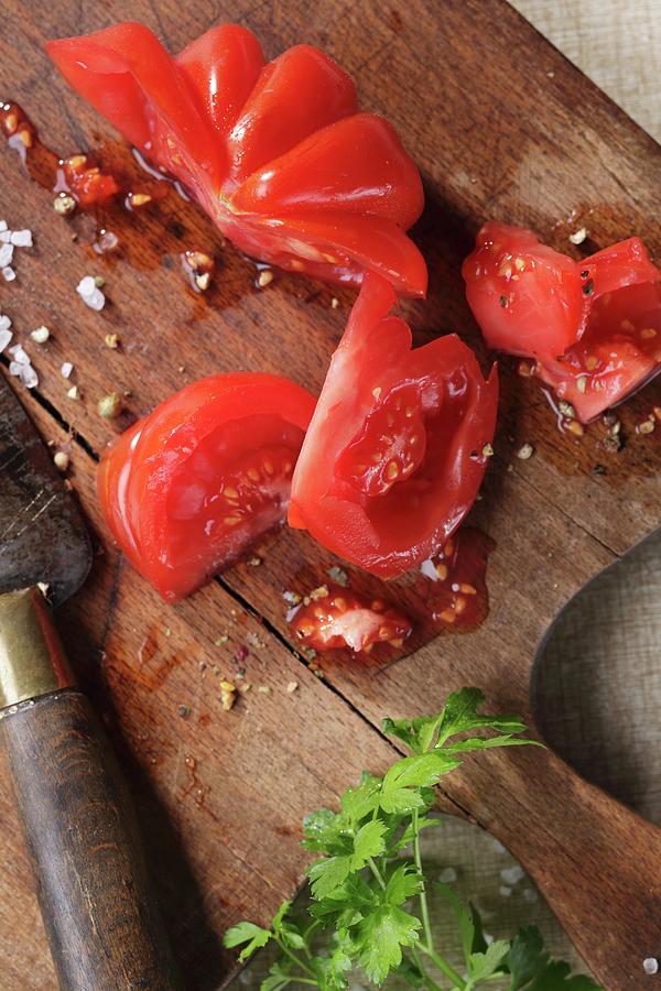 Sliced Beefsteak Tomatoes On A Wooden Board Photograph by Frank Weymann