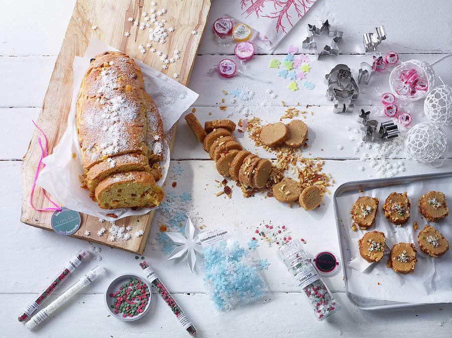 Sliced Christmas Stollen, Christmas Biscuits, And Cookie Cutters Photograph by Nikolai Buroh