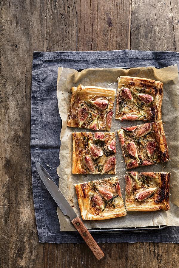 Sliced Fig Blue Cheese And Rosemary Tart On Baking Tray With Knife On Grey Background Photograph by Sarah Coghill