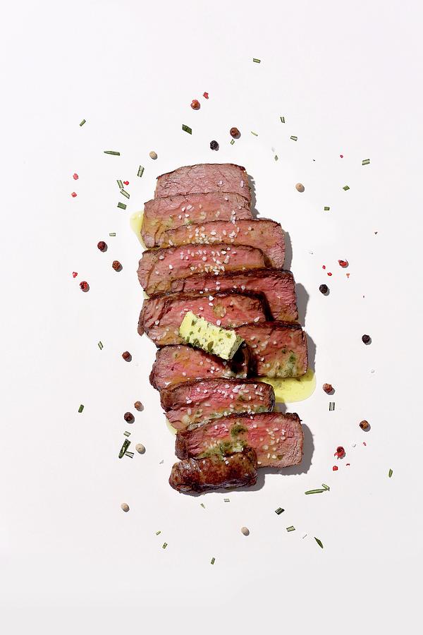 Sliced Medium Beefsteak With Herb Butter And Spices Photograph by Jalag / Michael Bernhardi