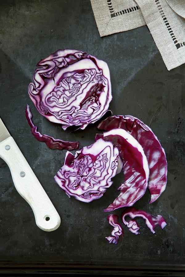 Sliced Red Cabbage And A Knife Photograph by Catja Vedder