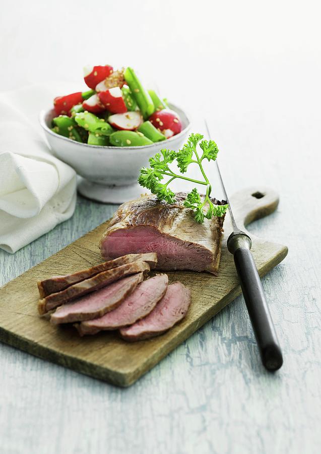Sliced Roast Beef With A Radish And Vegetable Salad Photograph by Mikkel Adsbl