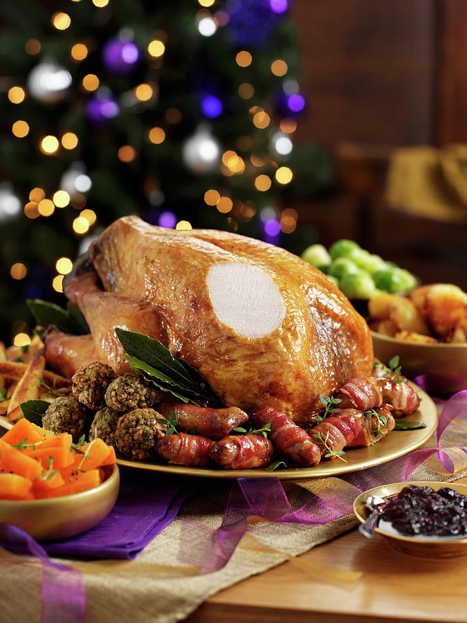 Sliced Roast Turkey With All The Trimmings On A Festive Table Photograph by Ian Garlick