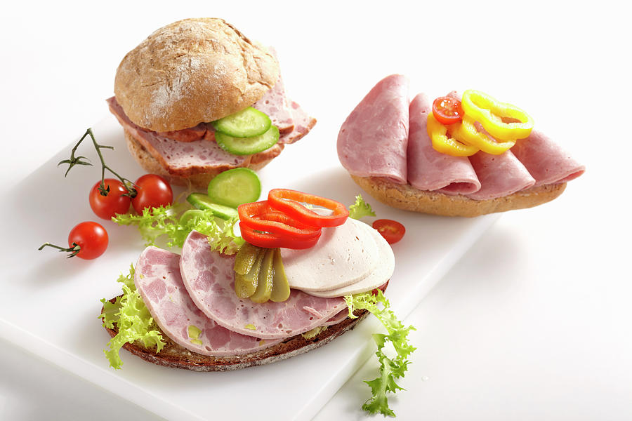 Sliced Sausage On Bread Rolls With Vegetables Photograph by Teubner Foodfoto