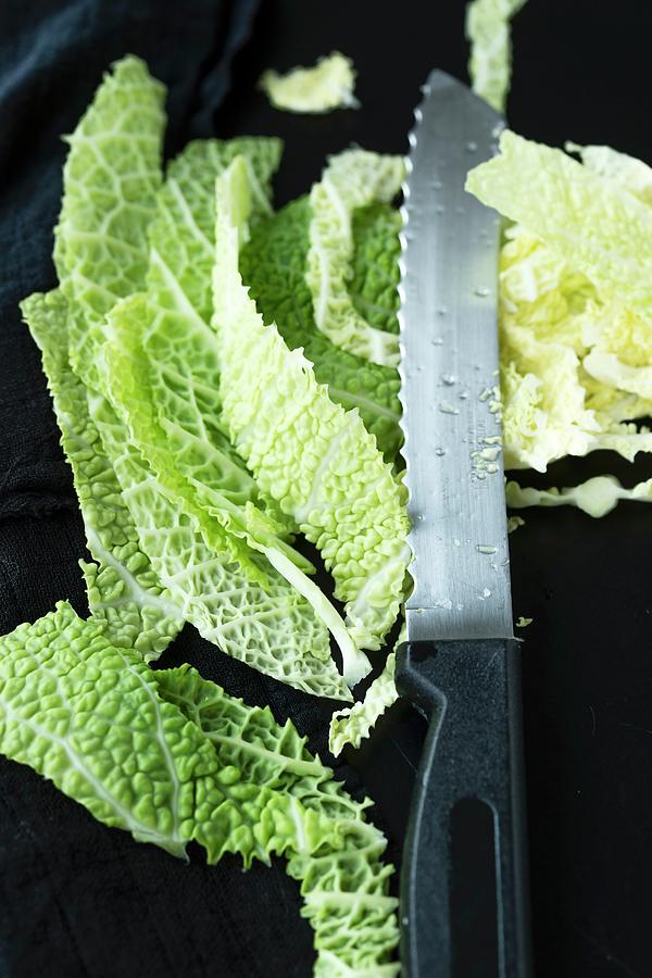 Sliced Savoy Cabbage With A Knife Photograph by Mandy Reschke