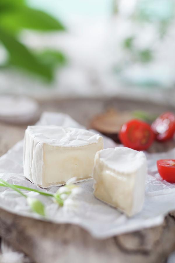 Sliced Soft Cheese With Tomatoes On A Wooden Board Photograph by Sabrina Sue Daniels