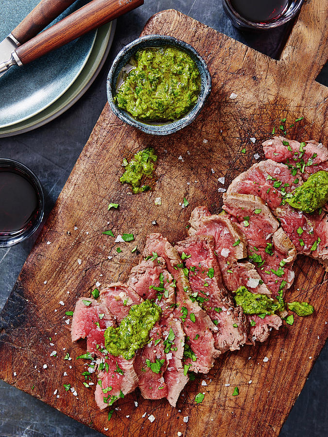 Sliced Steak With Salsa Verde Photograph by Ali Sid