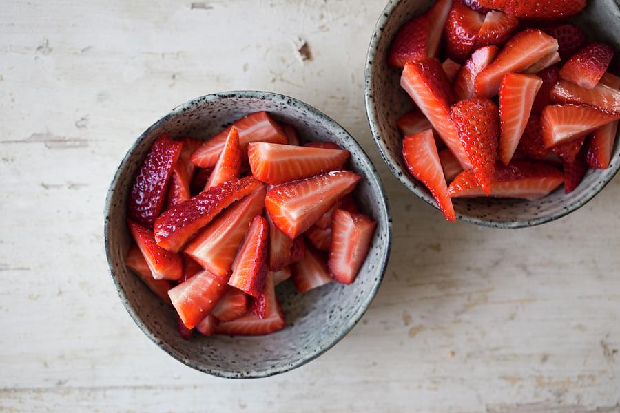 Sliced ??strawberries In Small Bowls Photograph by Nicole Godt