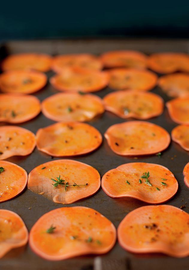 Sliced Sweet Potatoes With Herbs On A Baking Sheet Photograph by Strokin, Yelena
