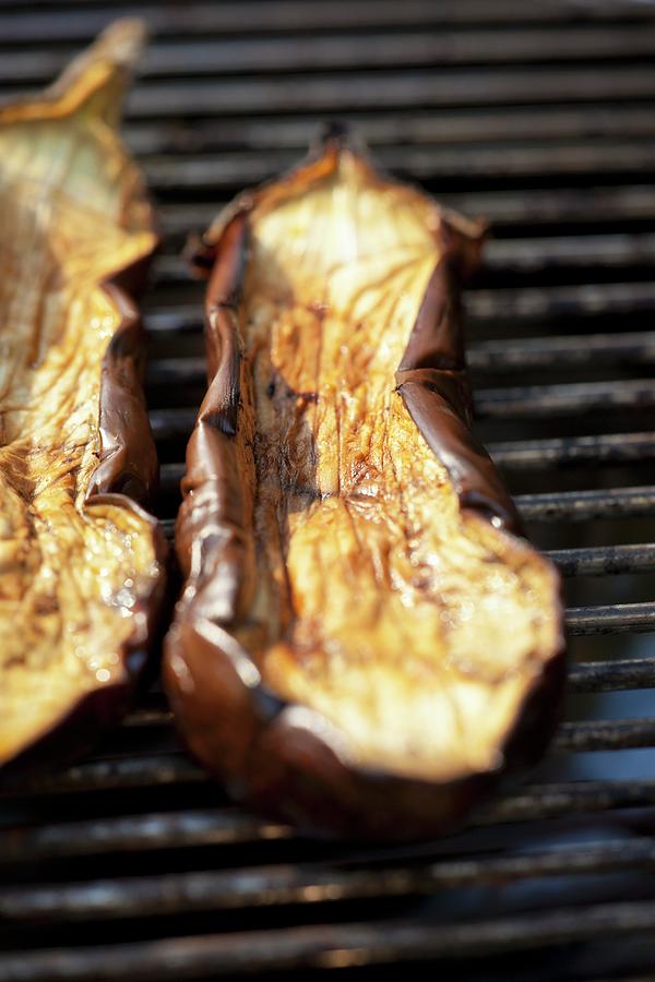 Slices Of Aubergine On The Barbecue Photograph by Studio Lipov
