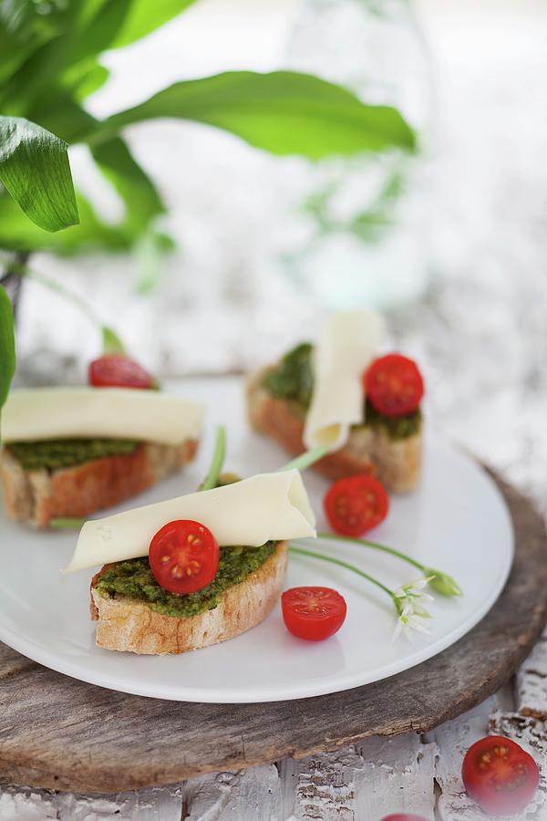 Slices Of Baguette Topped With Wild Garlic Pesto, Cheese And Cocktail Tomatoes Photograph by Sabrina Sue Daniels