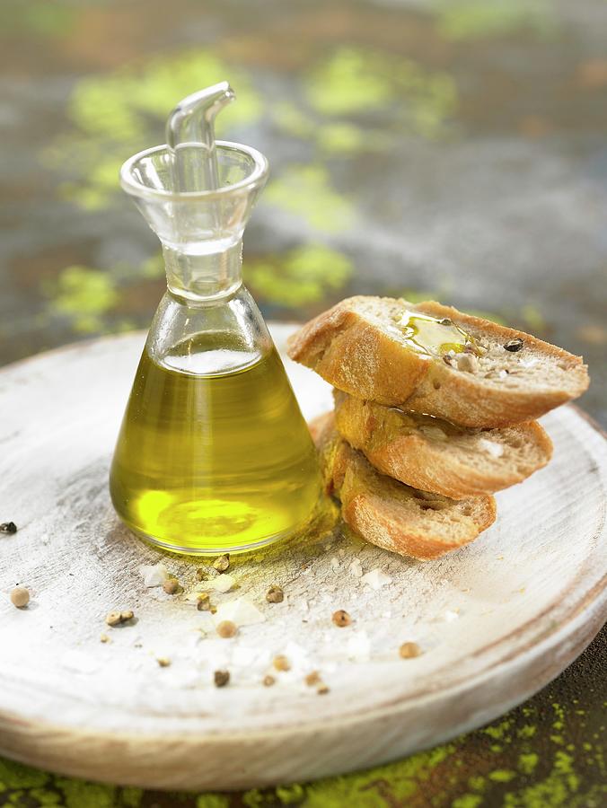 Slices Of Baguette With Olive Oil, Salt And Pepper Photograph by Lawton